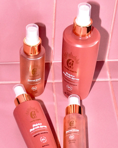Curly Angels Rejoice Refresh Spray And Sacred Scent against pink tiles Curly Angels Rejoice Refresh Spray And Sacred Scent against pink tiles
