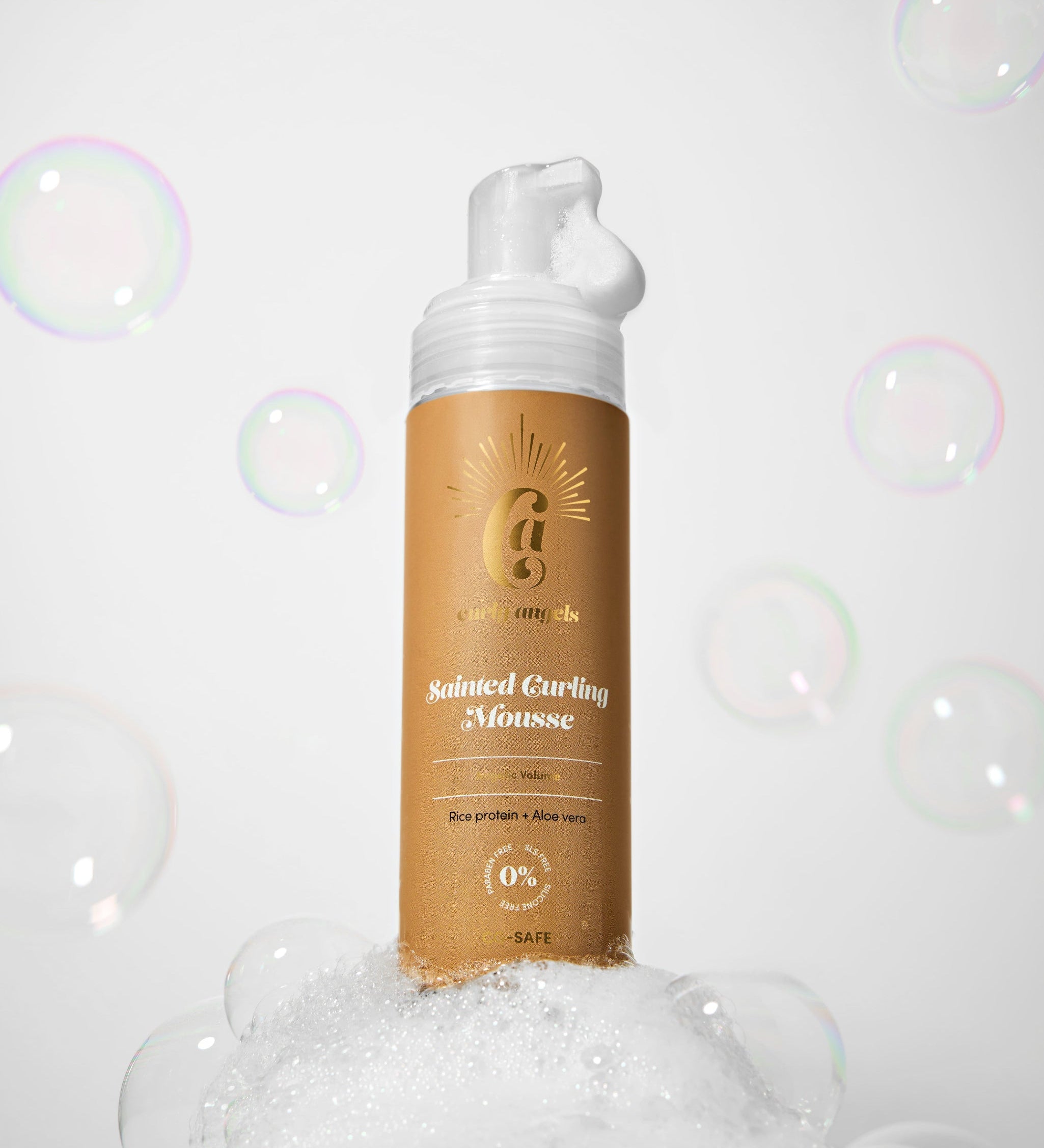 Curly Angels Sainted Curling Mousse against golden fabric backdrop