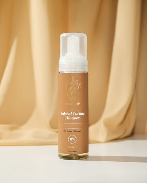 Curly Angels Sainted Curling Mousse against golden fabric backdrop