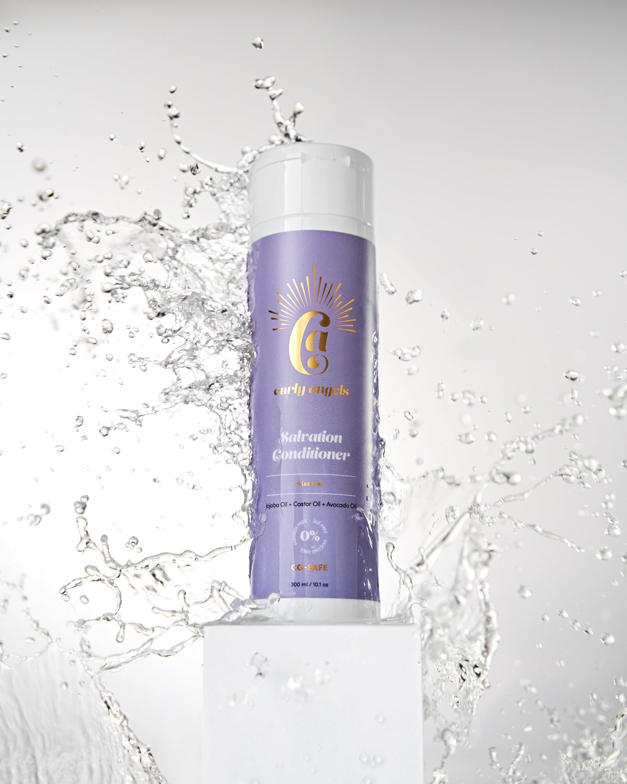 A bottle of vegan Salvation Conditioner by Curly Angel with a dynamic water splash in the background, deeply nourish and hydrate