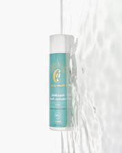 A bottle of Curly Angels vegan Hallelujah Curl Activator designed for enhancing and hydrating curls resting on water