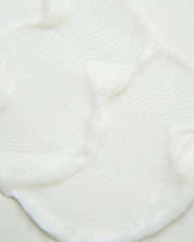 Curly Angels vegan Hallelujah Curl Activator designed for enhancing and hydrating curls pooled on a neautral background