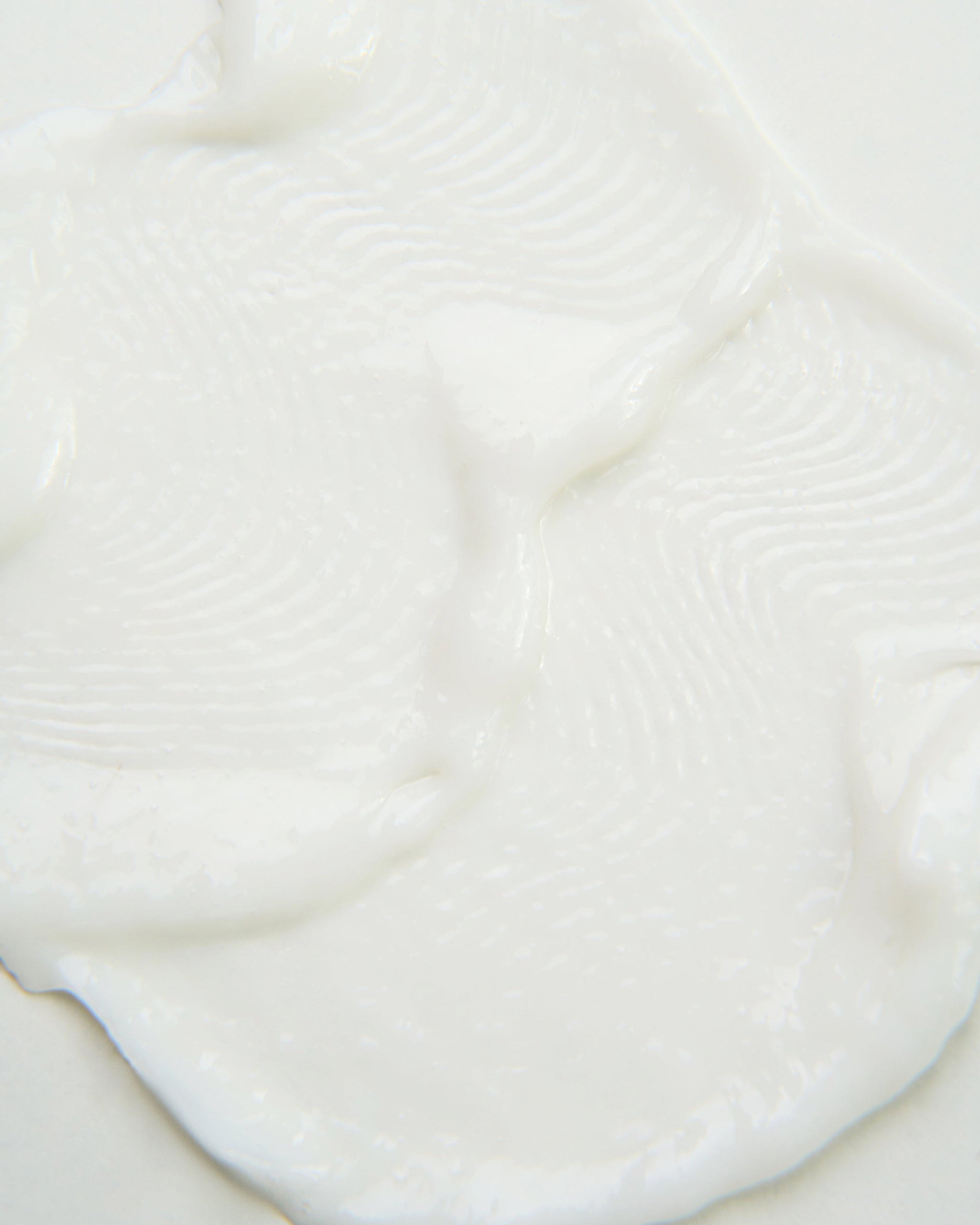 Curly Angels vegan Hallelujah Curl Activator designed for enhancing and hydrating curls pooled on a neautral background