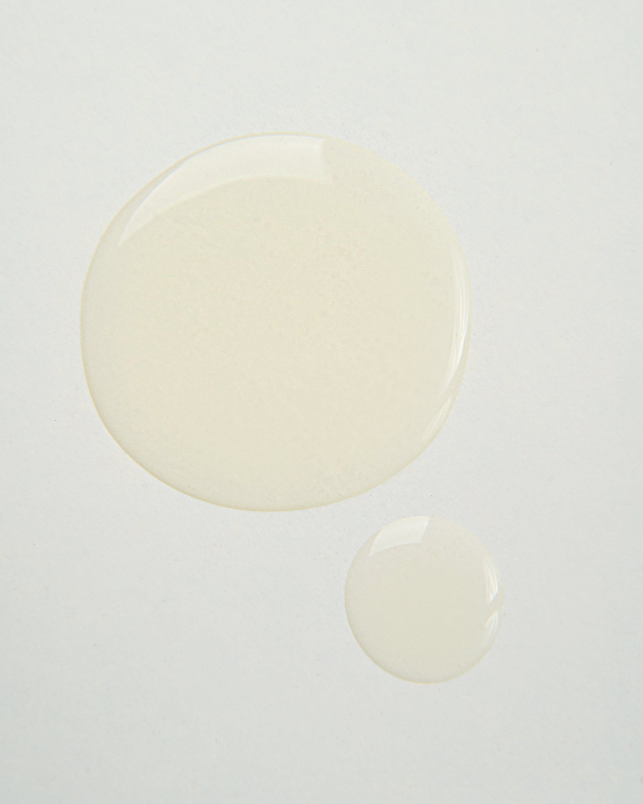 Curly Angels vegan Glorious Curling Gel two droplets on a white background