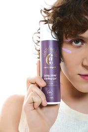 Model Holding a bottle of Curly Angels vegan Holy Hold Curling Gel